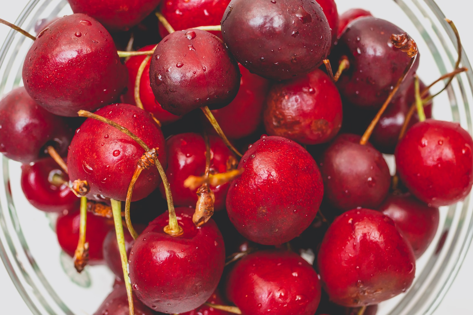 red cherries in close up photography